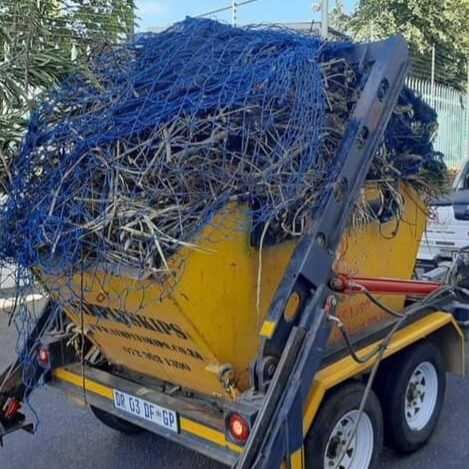 SimplySkips skip bin loaded on a trailer being collected in Roodepoort